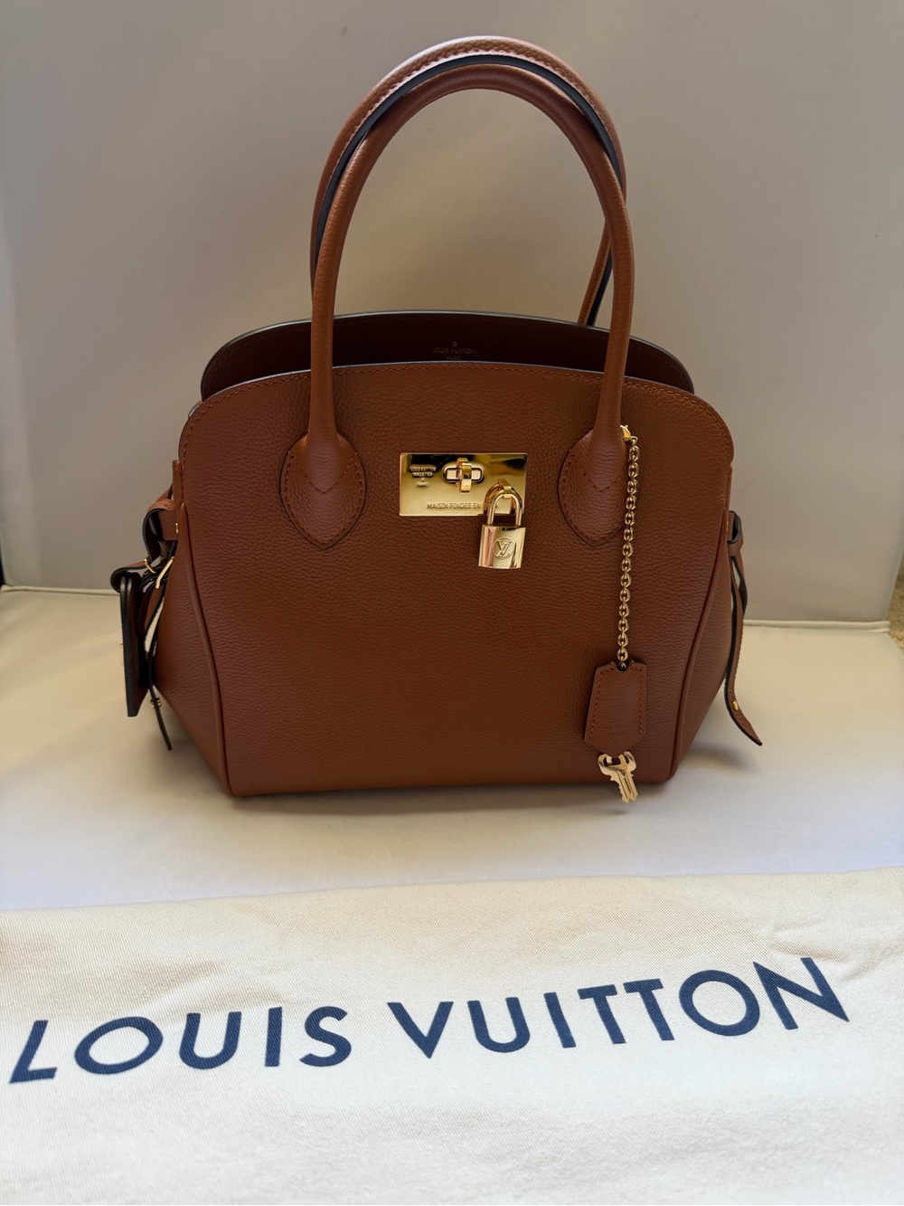 Louis Vuitton MILA PM Leather Satchel with Gold Padlock
